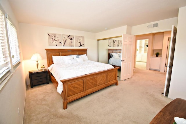 10908 Avenida Playa Veracruz, San Diego, CA 92124 - bedroom featuring light colored carpet and a closet