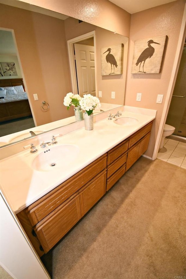 10908 Avenida Playa Veracruz, San Diego, CA 92124 - full bath featuring double vanity, toilet, a shower, connected bathroom, and tile patterned floors