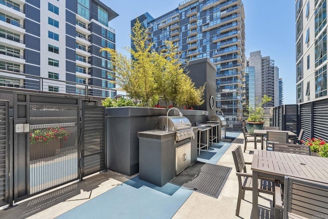 425 W Beech St Unit 1251, San Diego, CA 92101 - view of patio with a gate and outdoor dining area