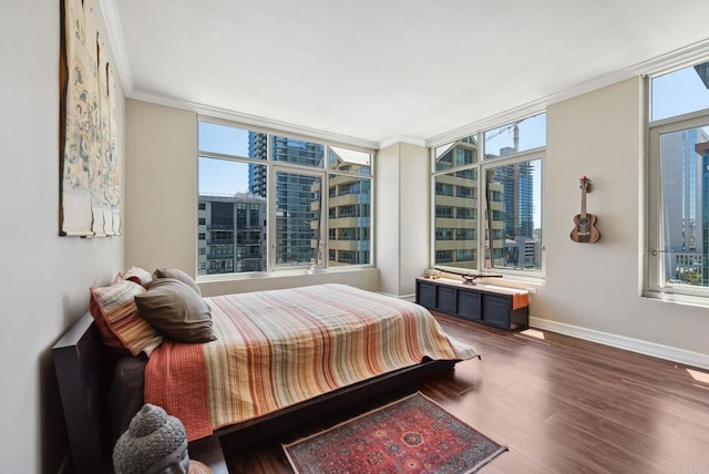 425 W Beech St Unit 1251, San Diego, CA 92101 - bedroom with multiple windows, ornamental molding, wood finished floors, and baseboards
