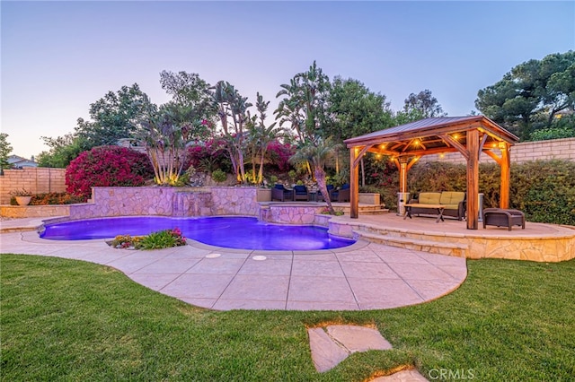 28367 Mount Stephen Ave, Canyon Country, CA 91387 - pool at dusk featuring outdoor lounge area, a gazebo, a fenced backyard, and a patio area