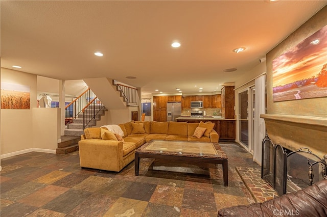 28367 Mount Stephen Ave, Canyon Country, CA 91387 - living room featuring recessed lighting, stairs, and dark stone finish floors