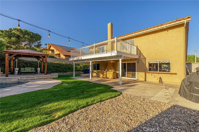 28367 Mount Stephen Ave, Canyon Country, CA 91387 - back of property featuring a balcony, outdoor lounge area, a patio, and a gazebo