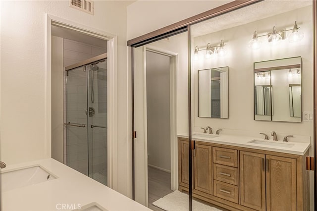 28367 Mount Stephen Ave, Canyon Country, CA 91387 - bathroom featuring double vanity and a shower stall