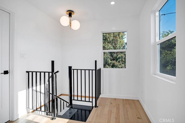 3031 4th Ave, Los Angeles, CA 90018 - staircase with plenty of natural light, hardwood / wood-style flooring, baseboards, and recessed lighting