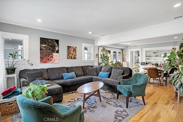 3031 4th Ave, Los Angeles, CA 90018 - living room featuring crown molding, light wood-type flooring, and recessed lighting