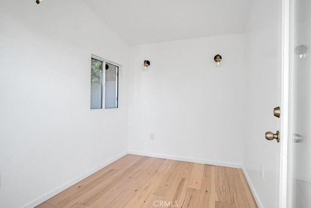 3031 4th Ave, Los Angeles, CA 90018 - spare room with light wood-style flooring, baseboards, and lofted ceiling