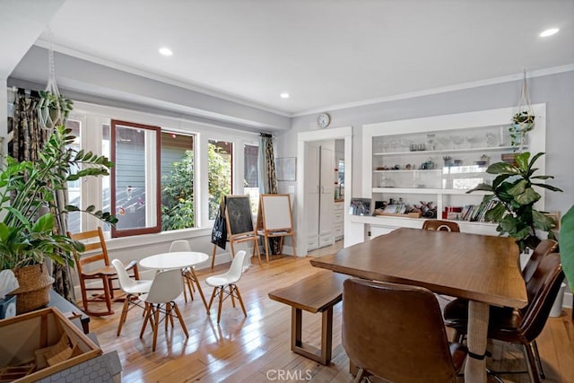 3031 4th Ave, Los Angeles, CA 90018 - dining area with crown molding, light wood-style flooring, and recessed lighting