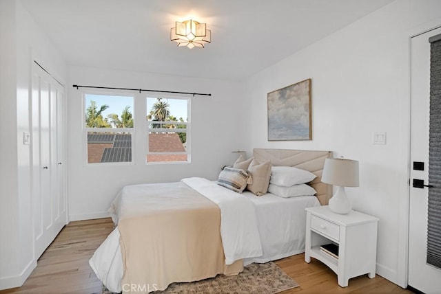 3031 4th Ave, Los Angeles, CA 90018 - bedroom featuring light wood-style flooring and baseboards