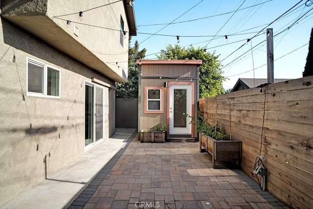 3031 4th Ave, Los Angeles, CA 90018 - view of patio with an outdoor structure