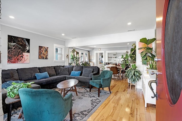 3031 4th Ave, Los Angeles, CA 90018 - living area with light wood-type flooring, crown molding, and recessed lighting