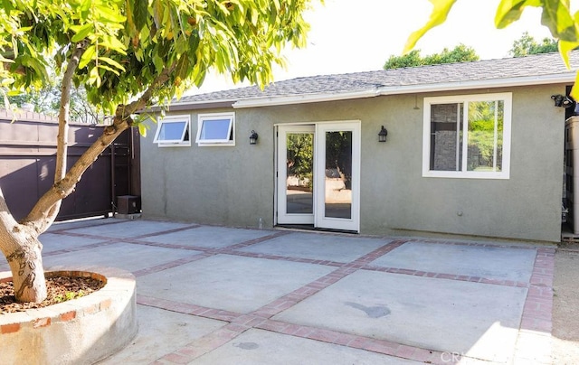 14816 Covello St, Van Nuys, CA 91405 - rear view of property with stucco siding, a patio area, and roof with shingles