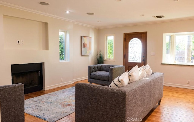 14816 Covello St, Van Nuys, CA 91405 - living room with plenty of natural light, light wood finished floors, baseboards, and crown molding