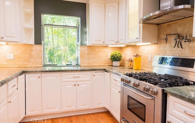 14816 Covello St, Van Nuys, CA 91405 - kitchen featuring gas range, range hood, white cabinetry, and decorative backsplash