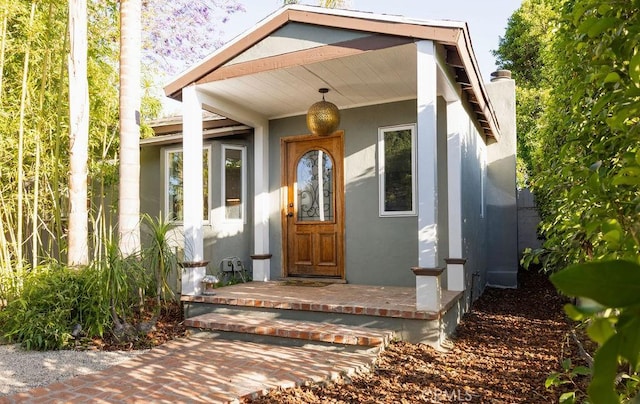 14816 Covello St, Van Nuys, CA 91405 - doorway to property with stucco siding and a chimney