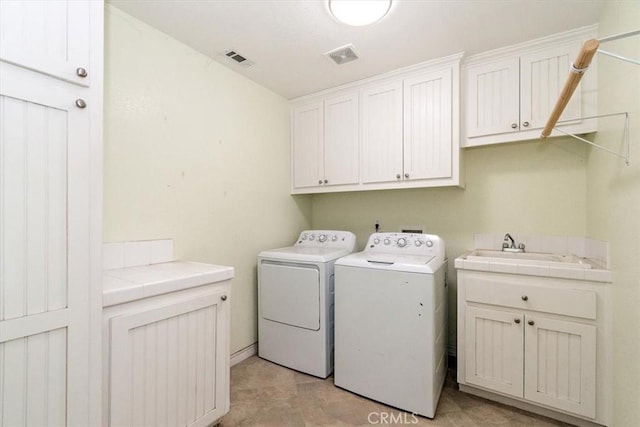 9050 Ponderosa Rd, Pinon Hills, CA 92372 - laundry area with cabinet space and washing machine and clothes dryer