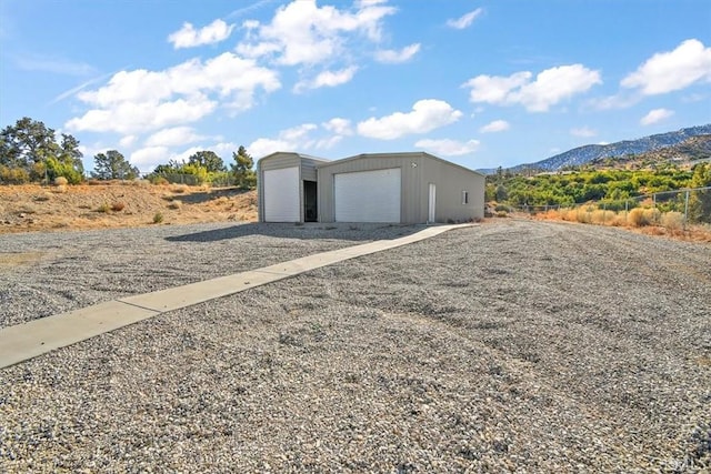 9050 Ponderosa Rd, Pinon Hills, CA 92372 - detached garage featuring a mountain view