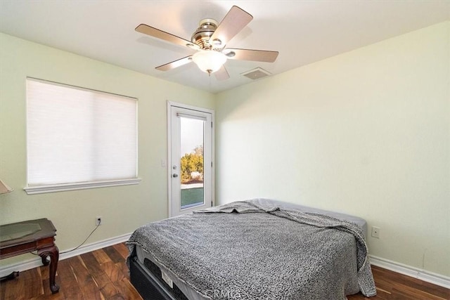 9050 Ponderosa Rd, Pinon Hills, CA 92372 - bedroom with access to outside, dark wood-style floors, baseboards, and multiple windows