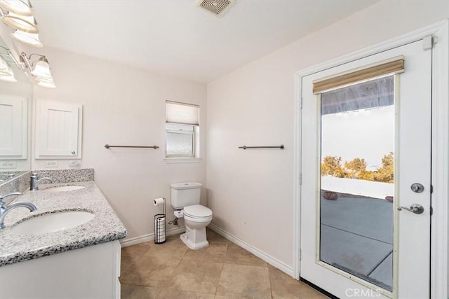 9050 Ponderosa Rd, Pinon Hills, CA 92372 - bathroom featuring baseboards, healthy amount of natural light, double vanity, and tile patterned flooring