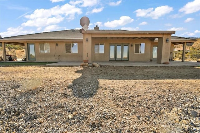 9050 Ponderosa Rd, Pinon Hills, CA 92372 - rear view of house featuring a patio and stucco siding