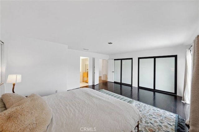 44310 Calle Bernardo, Temecula, CA 92590 - bedroom featuring wood finished floors and two closets
