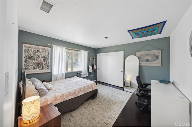 44310 Calle Bernardo, Temecula, CA 92590 - bedroom with wood finished floors, a desk, and a closet