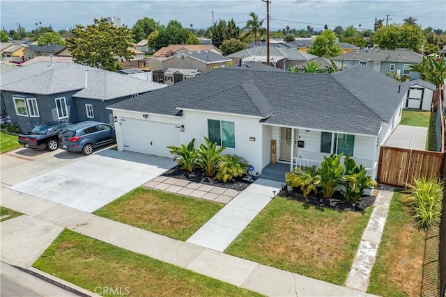 1422 S Exmoor Ave, Compton, CA 90220 - view of front of house with a residential view, an attached garage, roof with shingles, concrete driveway, and covered porch