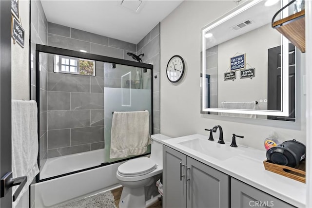 1422 S Exmoor Ave, Compton, CA 90220 - full bath featuring vanity, toilet, and enclosed tub / shower combo