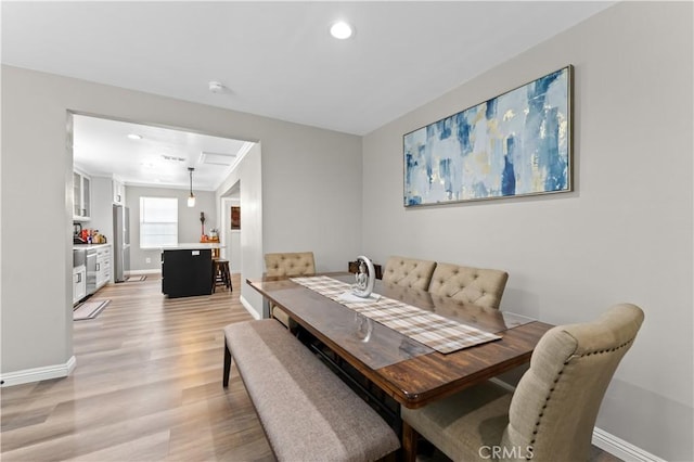 1422 S Exmoor Ave, Compton, CA 90220 - dining space with light wood finished floors, recessed lighting, and baseboards