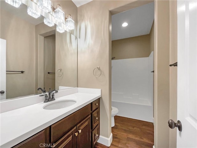 25329 Wild View Rd, Menifee, CA 92584 - bathroom featuring vanity, wood finished floors, toilet, and shower / washtub combination