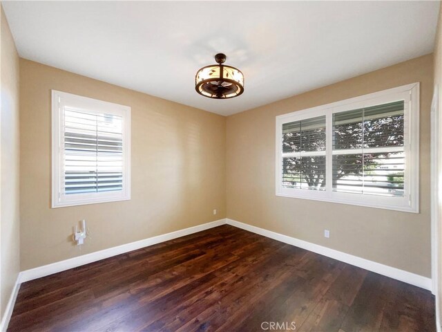 25329 Wild View Rd, Menifee, CA 92584 - empty room featuring plenty of natural light, dark wood-type flooring, and baseboards