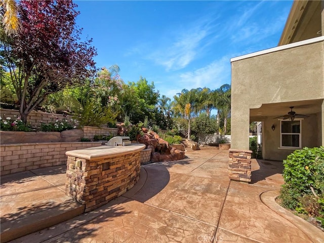 25329 Wild View Rd, Menifee, CA 92584 - view of patio with an outdoor kitchen and a ceiling fan