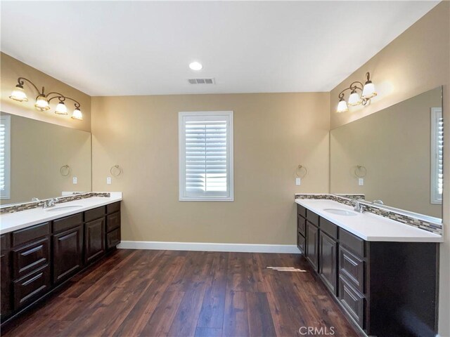 25329 Wild View Rd, Menifee, CA 92584 - full bathroom featuring two vanities, baseboards, and wood finished floors