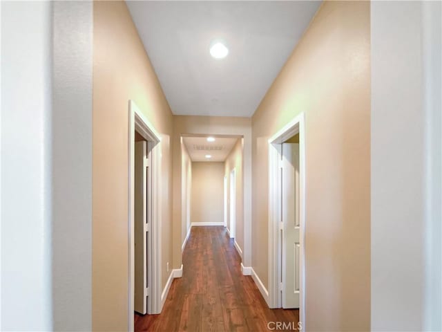 25329 Wild View Rd, Menifee, CA 92584 - hall with dark wood finished floors, baseboards, and recessed lighting