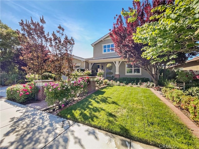 25329 Wild View Rd, Menifee, CA 92584 - view of front of home with a front lawn, stucco siding, and a porch