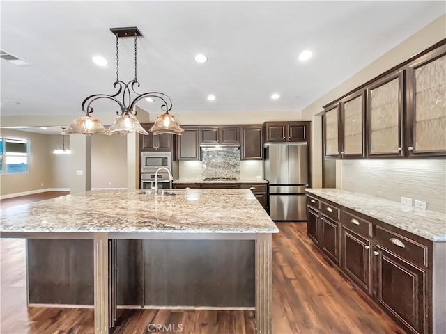 25329 Wild View Rd, Menifee, CA 92584 - kitchen featuring stainless steel appliances, a sink, dark brown cabinetry, decorative backsplash, and recessed lighting