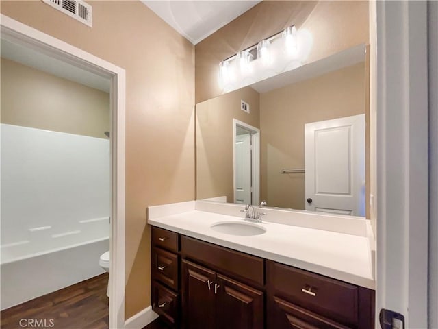 25329 Wild View Rd, Menifee, CA 92584 - full bath featuring vanity, toilet, wood finished floors, and bathtub / shower combination