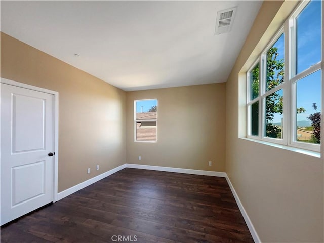 25329 Wild View Rd, Menifee, CA 92584 - empty room featuring dark wood-style flooring and baseboards