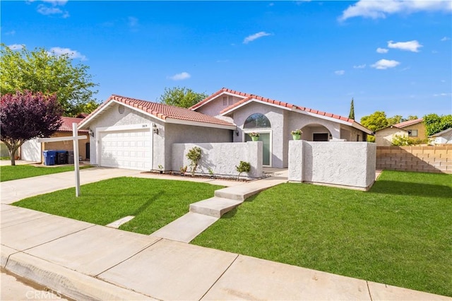 1819 Acosta Ave, Lancaster, CA 93535 - mediterranean / spanish home featuring a tile roof, a garage, stucco siding, and concrete driveway