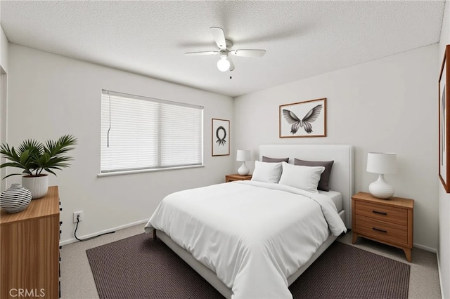 1819 Acosta Ave, Lancaster, CA 93535 - bedroom featuring carpet floors, baseboards, a textured ceiling, and a ceiling fan