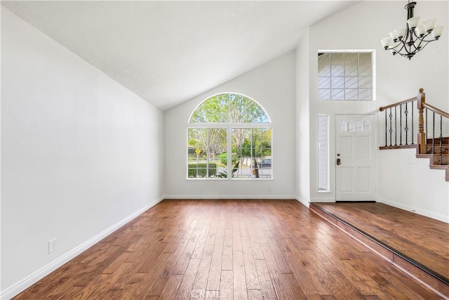 32911 Danaoak, Dana Point, CA 92629 - entrance foyer with wood-type flooring, a chandelier, stairs, baseboards, and high vaulted ceiling