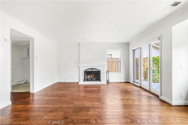 32911 Danaoak, Dana Point, CA 92629 - unfurnished living room with healthy amount of natural light, wood-type flooring, a fireplace, ornamental molding, and baseboards