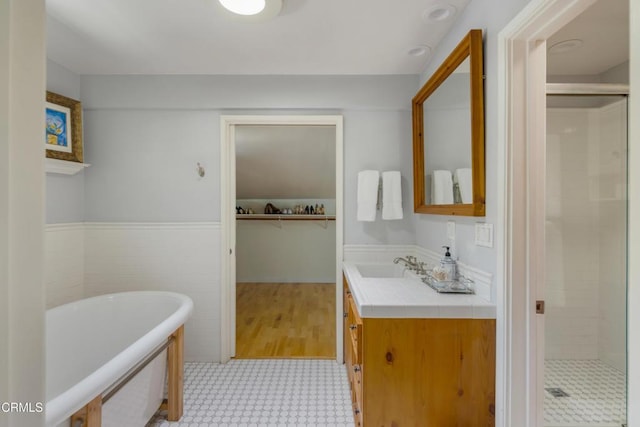448 W Montecito Ave, Sierra Madre, CA 91024 - bathroom featuring tile patterned floors, vanity, a freestanding bath, a shower stall, and wainscoting