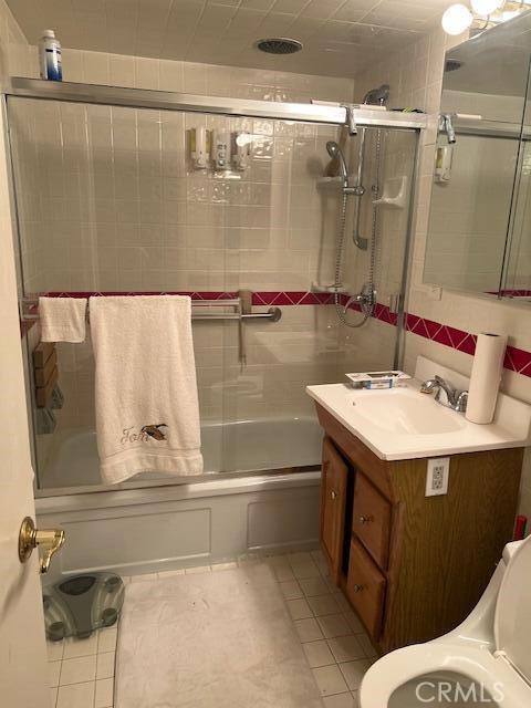 38833 Sage Tree St, Palmdale, CA 93551 - full bathroom featuring vanity, combined bath / shower with glass door, and tile patterned flooring