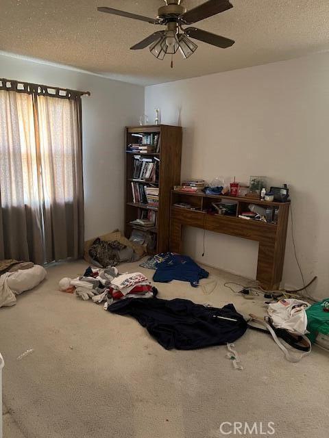 38833 Sage Tree St, Palmdale, CA 93551 - bedroom with carpet, a textured ceiling, and ceiling fan