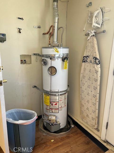 38833 Sage Tree St, Palmdale, CA 93551 - utility room featuring water heater