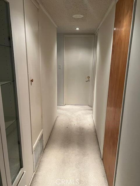 38833 Sage Tree St, Palmdale, CA 93551 - corridor featuring a textured ceiling