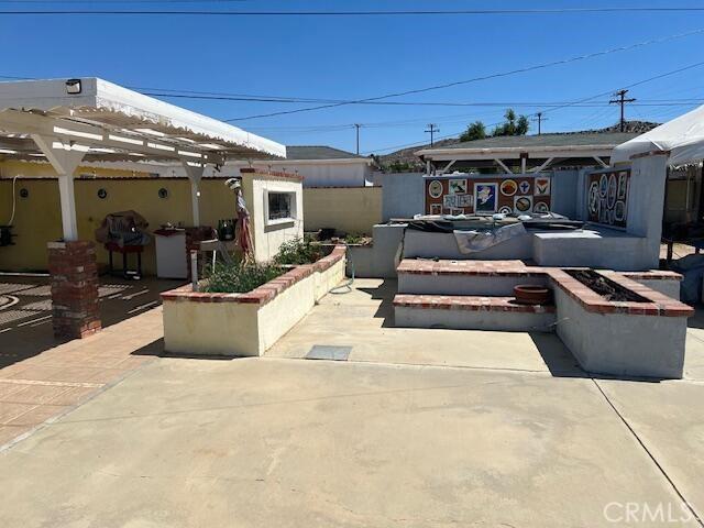 38833 Sage Tree St, Palmdale, CA 93551 - view of patio featuring a pergola