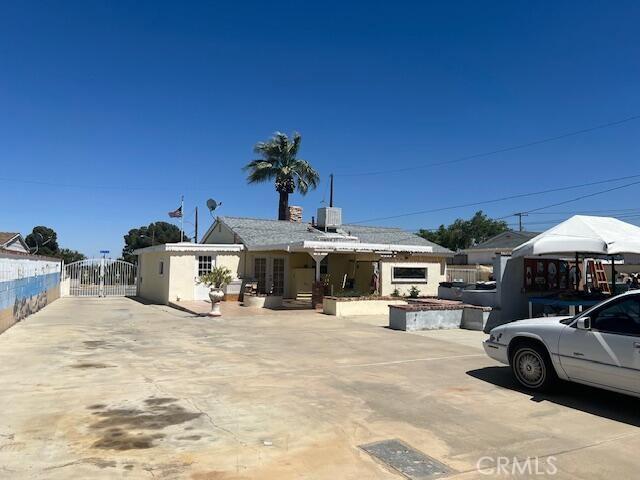 38833 Sage Tree St, Palmdale, CA 93551 - view of front facade with a gate and cooling unit