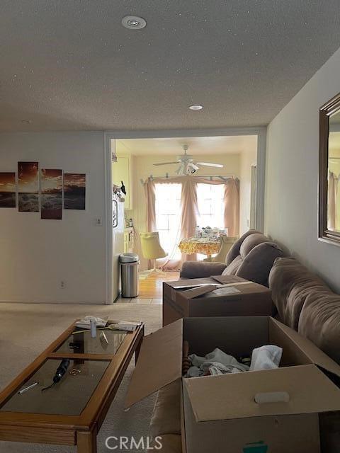 38833 Sage Tree St, Palmdale, CA 93551 - living area with a ceiling fan and a textured ceiling